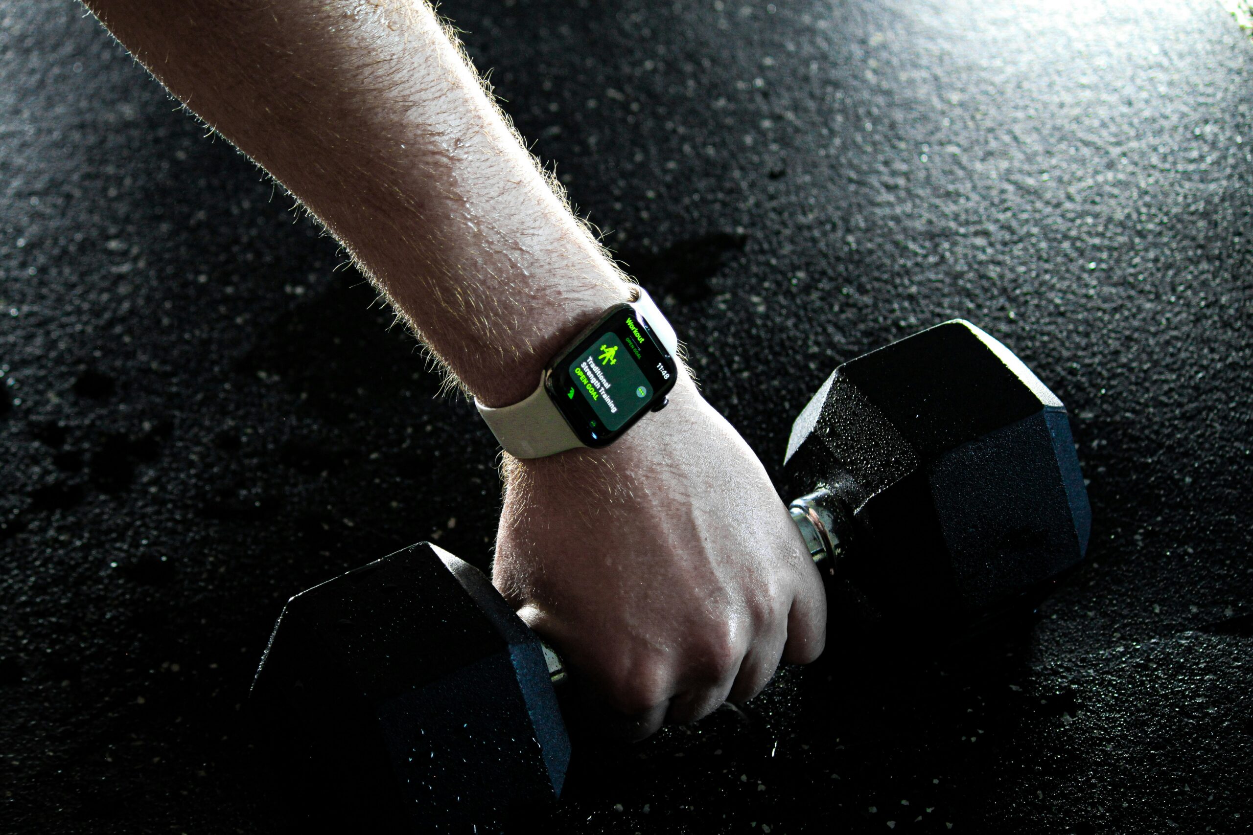 Person holding Apple Watch